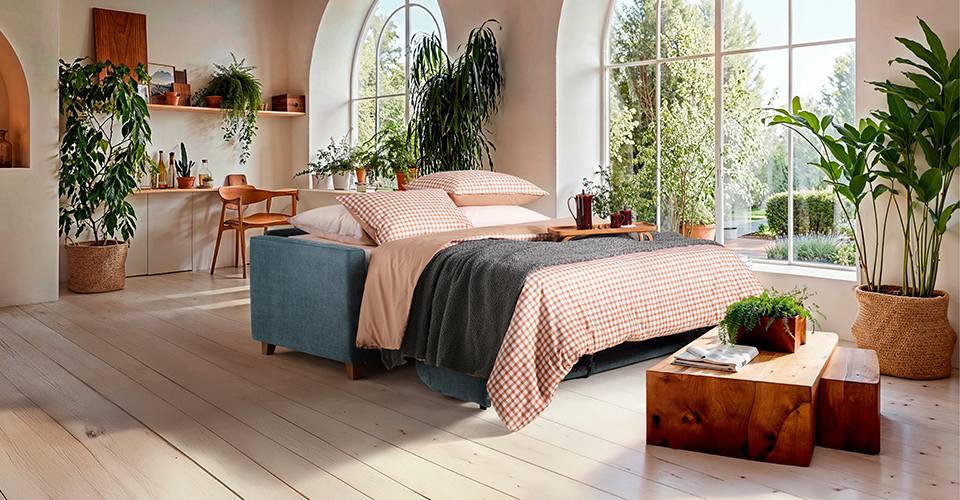 canapé convertible dans un loft au style industriel et contemporain